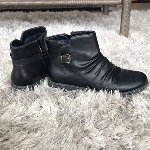 Women’s black boots.